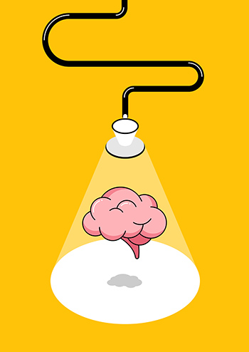 A spotlight on a brain with a mustard background